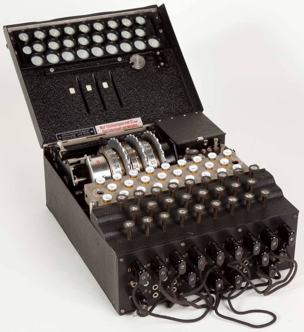 Original Enigma machine open — rotor assembly, keyboard and plugboard visible